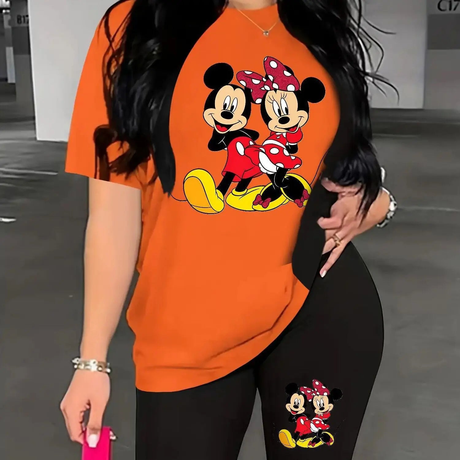 A Two-Piece Outfit Featuring a Printed Short-Sleeve T-Shirt with Dropped Shoulders And Cropped Leggings, Designed for Plus-Size Women, Licensed with Mickey And Minnie. Lady T Fashions