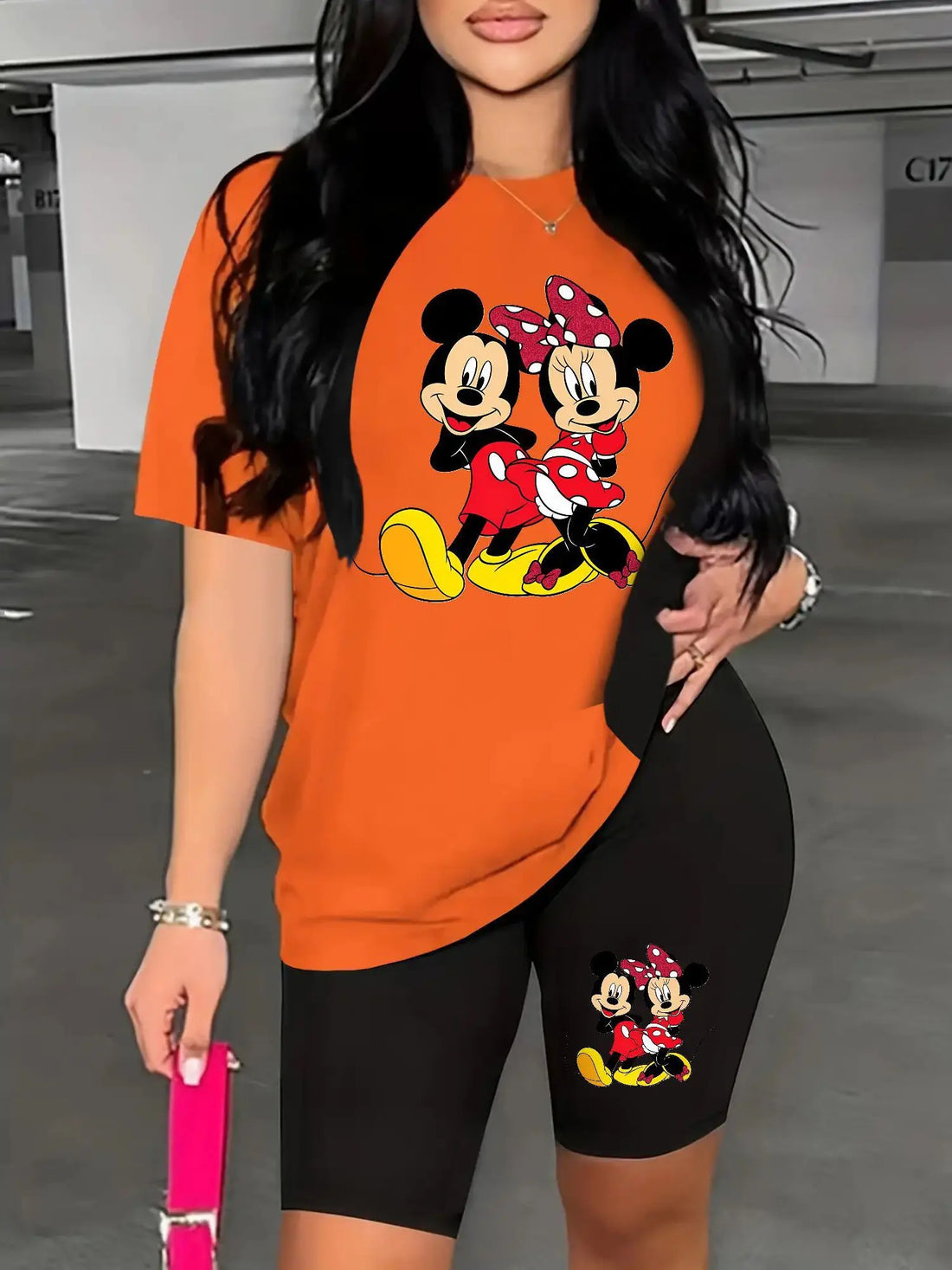 A Two-Piece Outfit Featuring a Printed Short-Sleeve T-Shirt with Dropped Shoulders And Cropped Leggings, Designed for Plus-Size Women, Licensed with Mickey And Minnie. Lady T Fashions