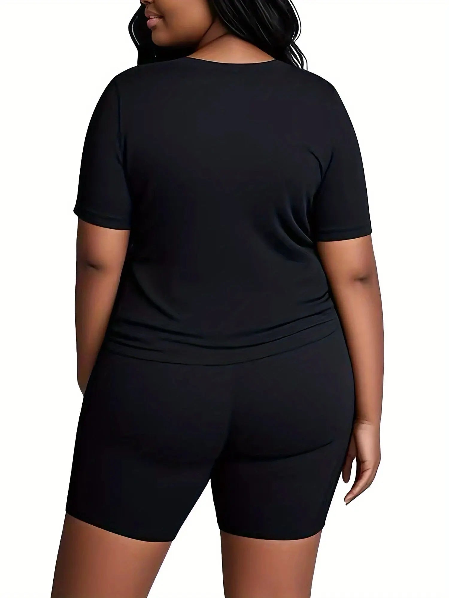 A Two-Piece Outfit Featuring a Printed Short-Sleeve T-Shirt with Dropped Shoulders And Cropped Leggings, Designed for Plus-Size Women, Licensed with Mickey And Minnie. Lady T Fashions